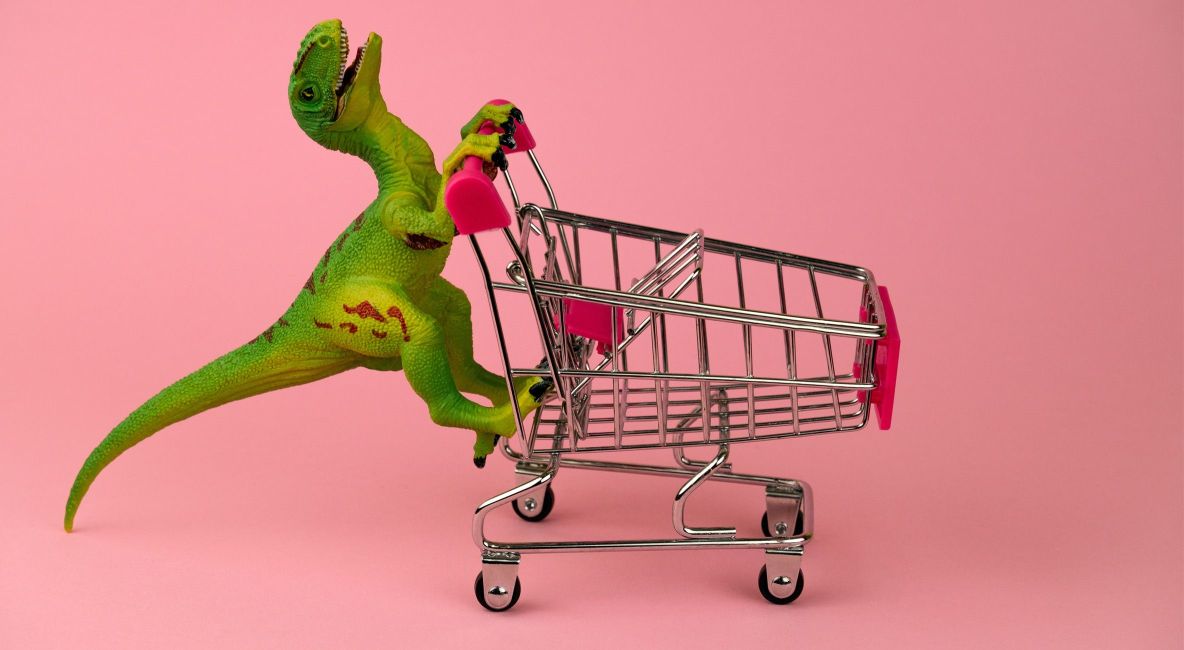 Green Dino Pushing Shopping Cart - Post Image